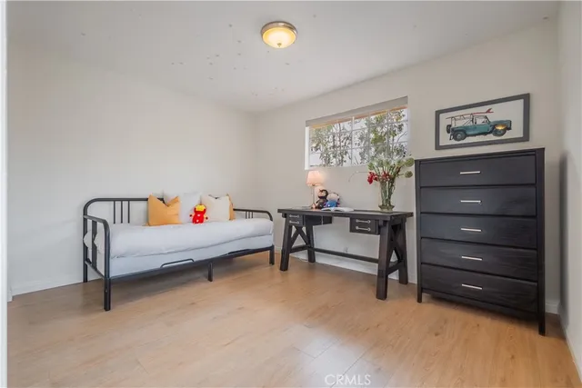 a view of a patio with table and chairs potted plants