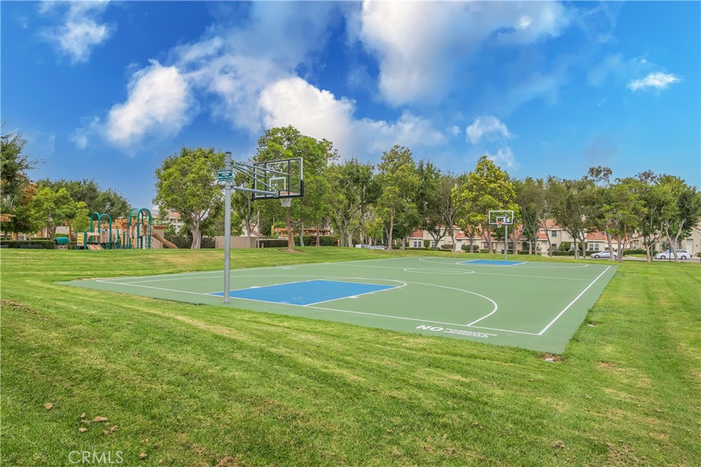 19 Dartmouth Irvine, CA 92612 - Photo 30 of 44 a view of a golf course with a lake
