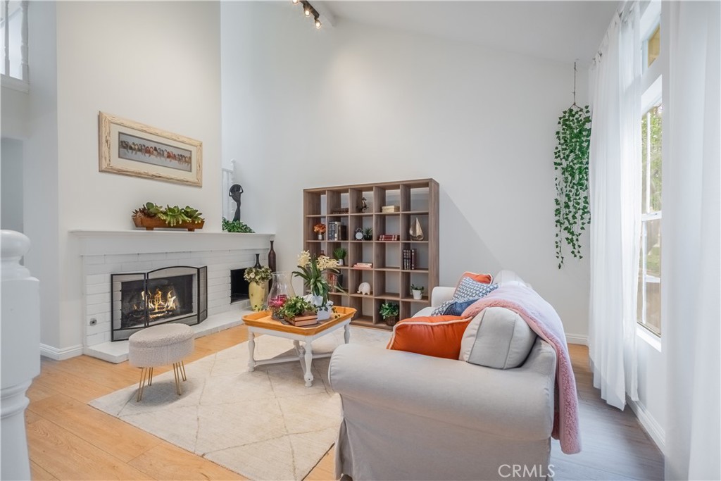19 Dartmouth Irvine, CA 92612 - Photo 3 of 44 a living room with furniture and a fireplace