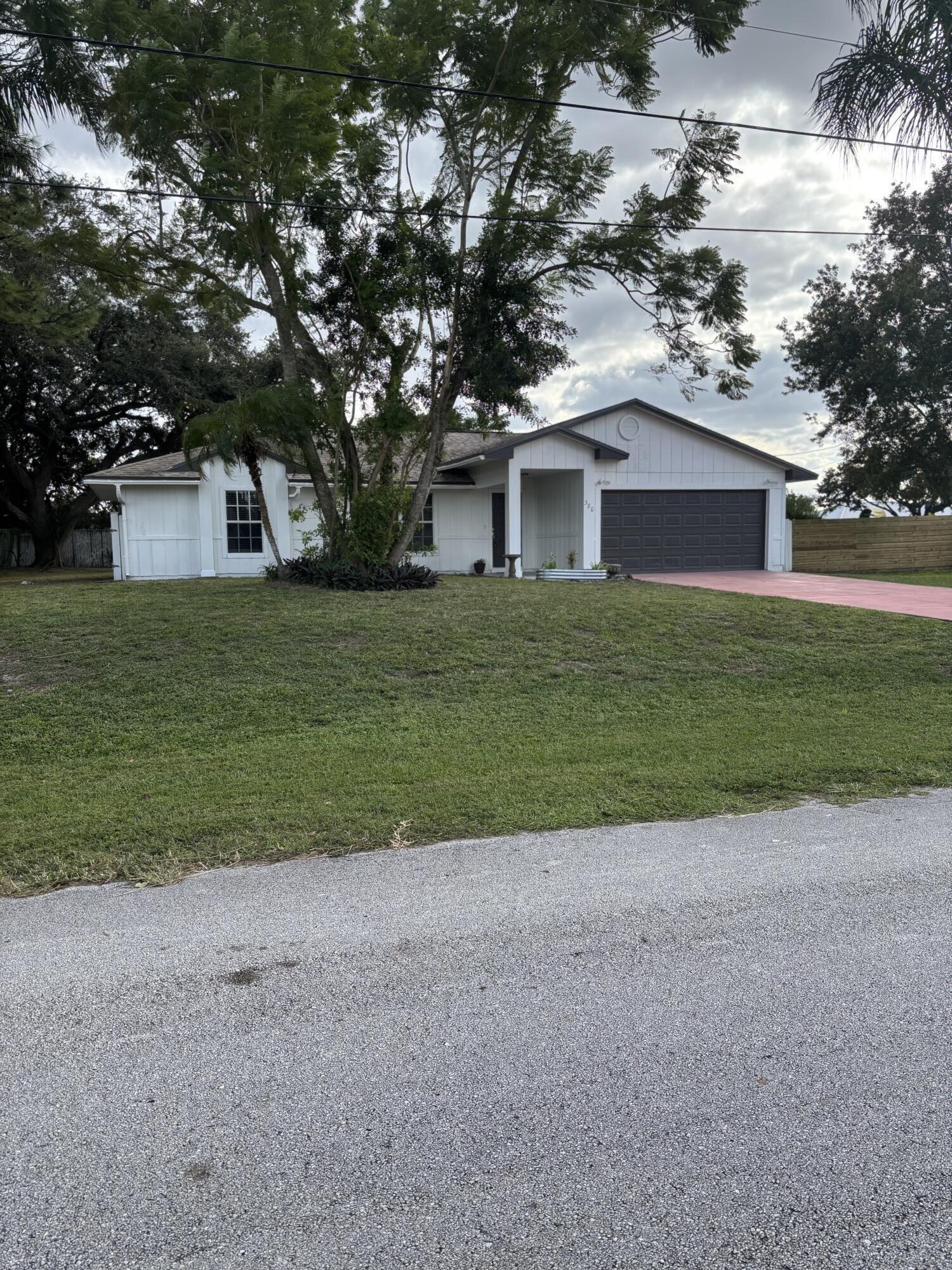 380 Southwest Undallo Road Port St. Lucie, FL 34953 - Photo 1 of 16 Front