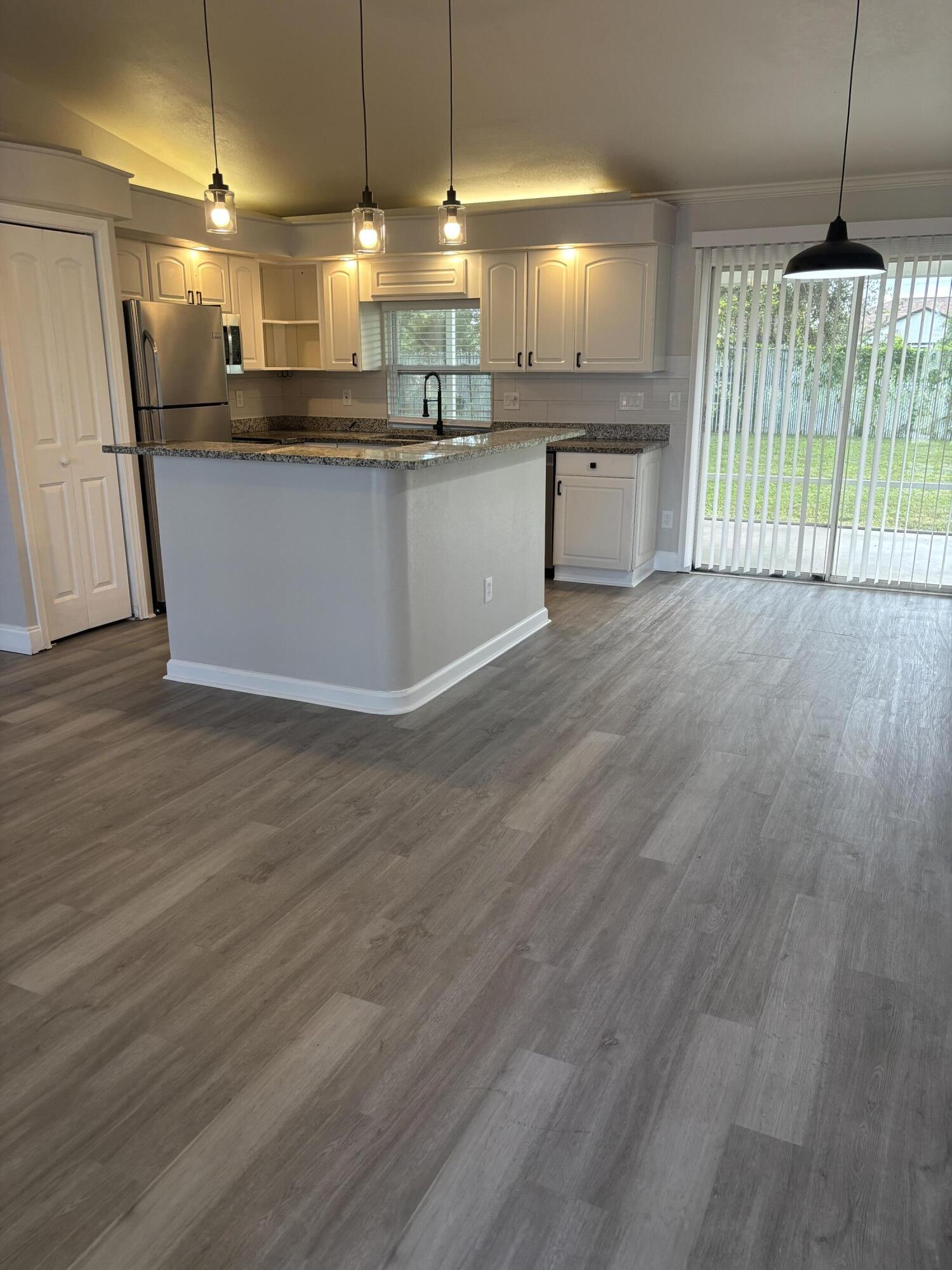 380 Southwest Undallo Road Port St. Lucie, FL 34953 - Photo 6 of 16 Kitchen and dining area