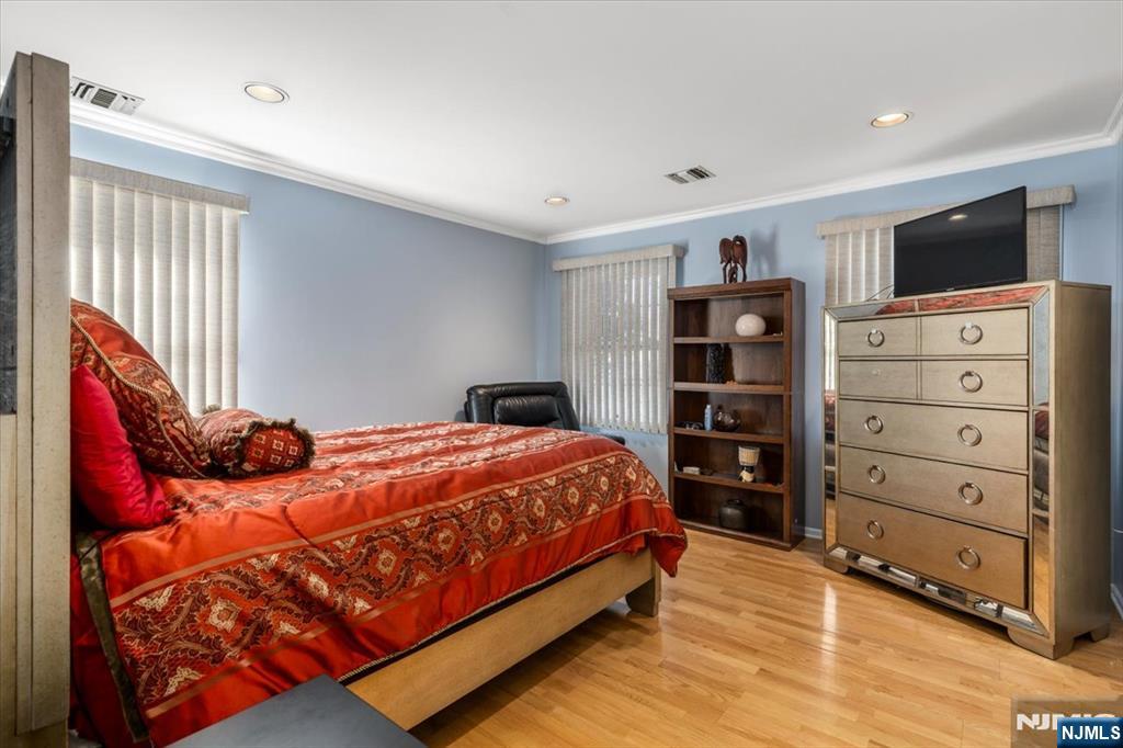2 Crystal Lane, Unit 294 Paterson, NJ 07501 - Photo 11 of 30 a bedroom with a bed and a television