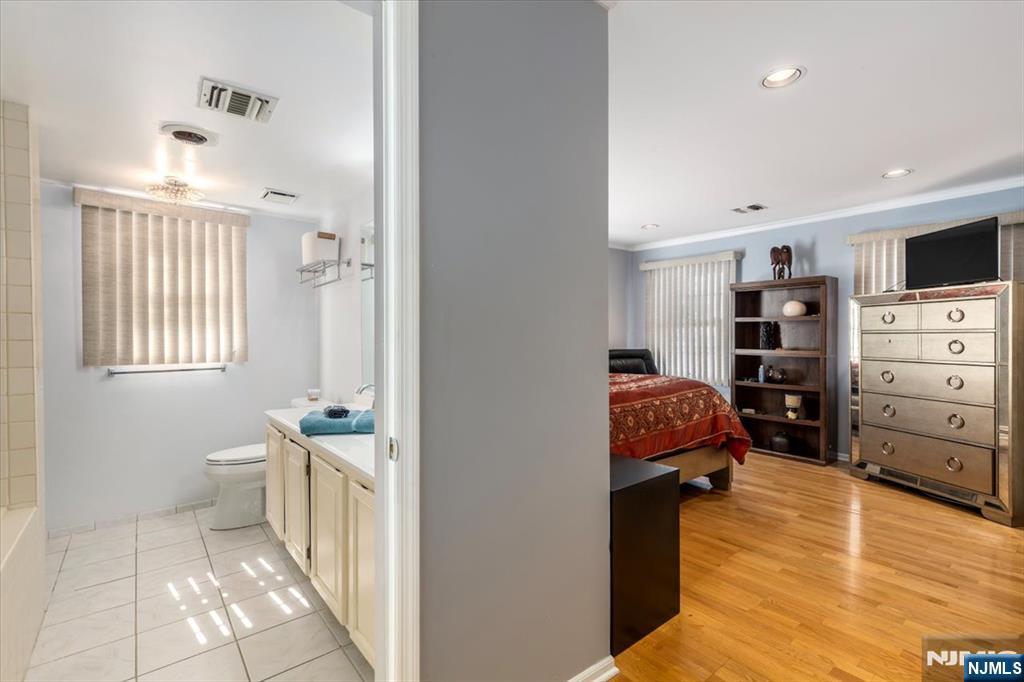 2 Crystal Lane, Unit 294 Paterson, NJ 07501 - Photo 13 of 30 a view of walk in closet with clothes and shoes