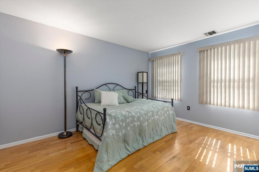 2 Crystal Lane, Unit 294 Paterson, NJ 07501 - Photo 18 of 30 a bedroom with a bed and a window