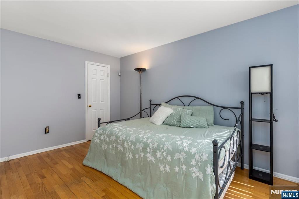 2 Crystal Lane, Unit 294 Paterson, NJ 07501 - Photo 19 of 30 a bedroom with a bed and a window