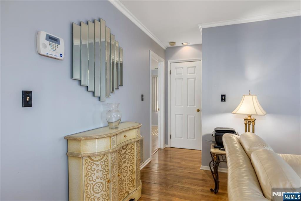 2 Crystal Lane, Unit 294 Paterson, NJ 07501 - Photo 22 of 30 a view of a room with wooden floor table and chair