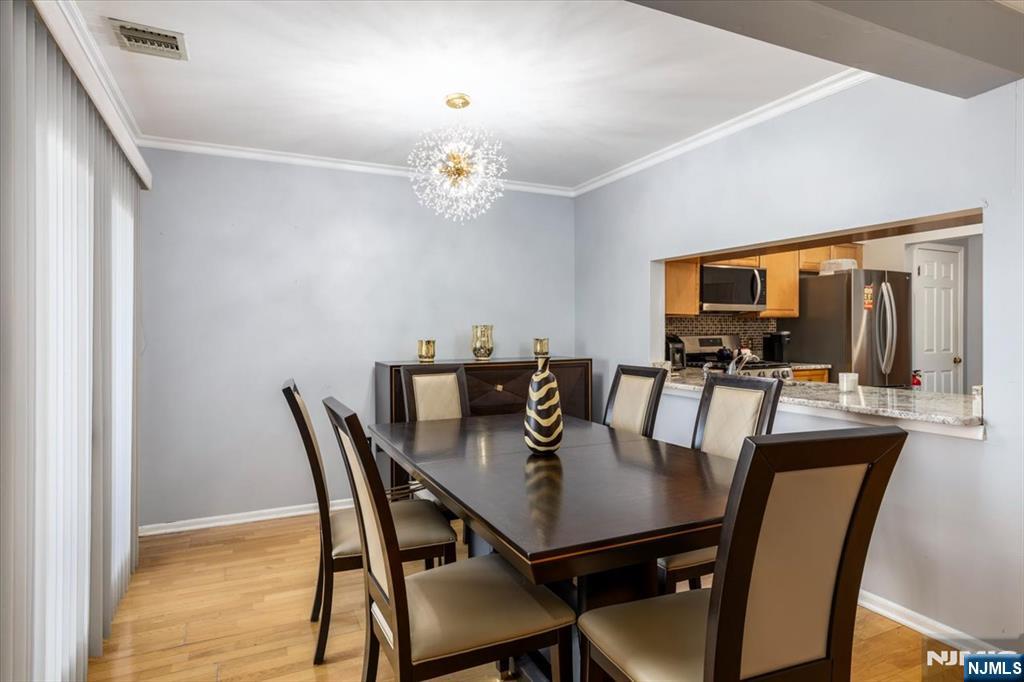 2 Crystal Lane, Unit 294 Paterson, NJ 07501 - Photo 7 of 30 a view of a dining room with furniture