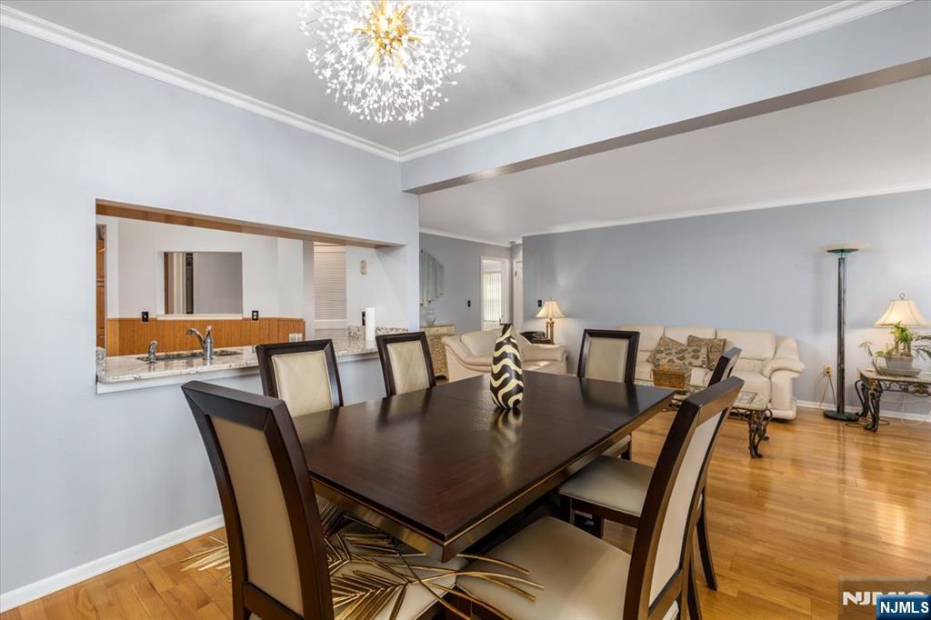 2 Crystal Lane, Unit 294 Paterson, NJ 07501 - Photo 8 of 30 a view of a dining room with furniture and wooden floor