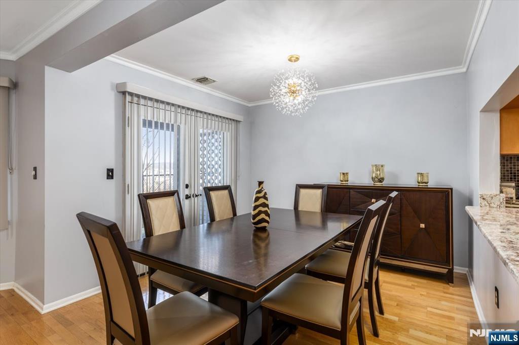 2 Crystal Lane, Unit 294 Paterson, NJ 07501 - Photo 9 of 30 a view of a dining room with a table and chairs