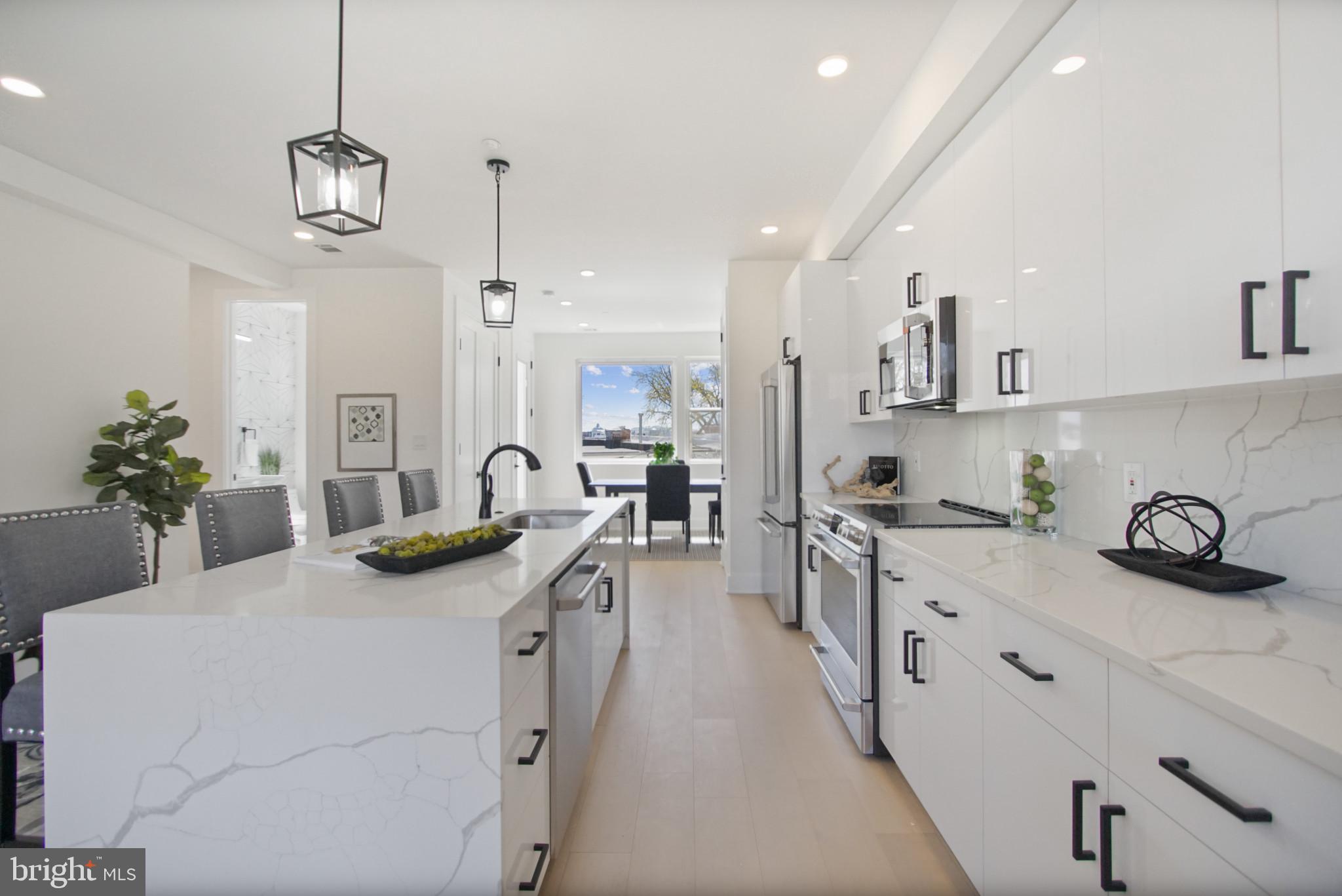 623 Florida Avenue Northeast, Unit PH2 Washington, DC 20002 - Photo 11 of 32 White quartz, state-of-art kitchen