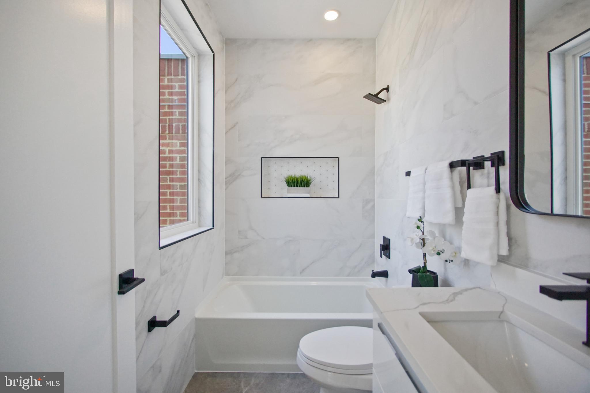 623 Florida Avenue Northeast, Unit PH2 Washington, DC 20002 - Photo 23 of 32 White quartz bathroom