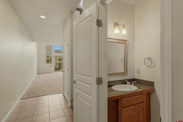 a bathroom with a sink double vanity and a mirror