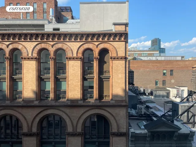 a view of a kitchen with stainless steel appliances granite countertop a stove and a kitchen island with a dishwasher