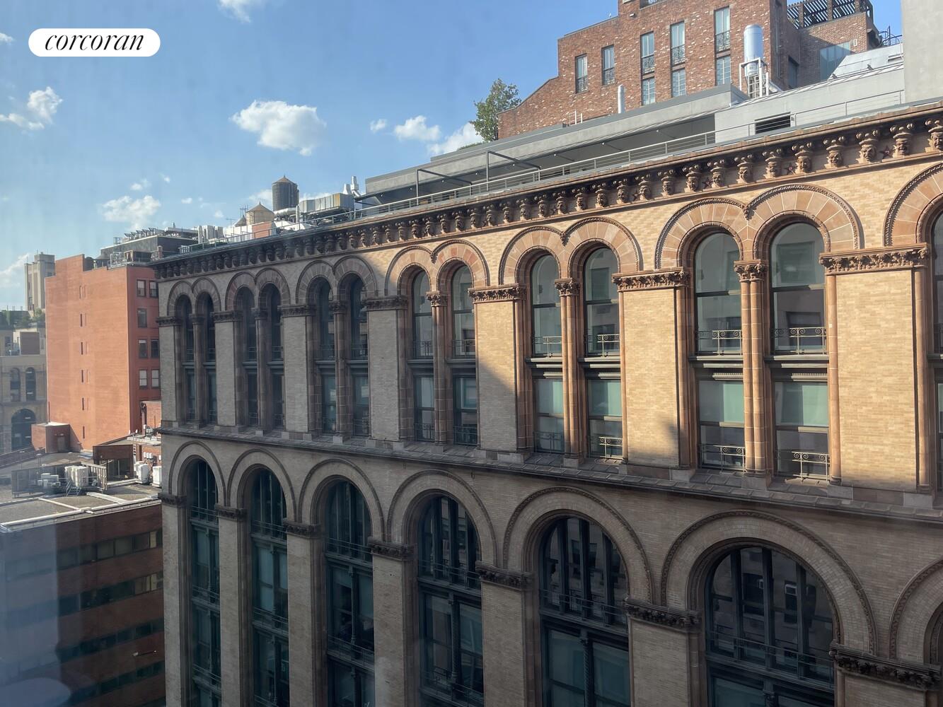 14 East 4th Street, Unit 827 Manhattan, NY 10012 - Photo 9 of 10 a front view of a house with glass windows