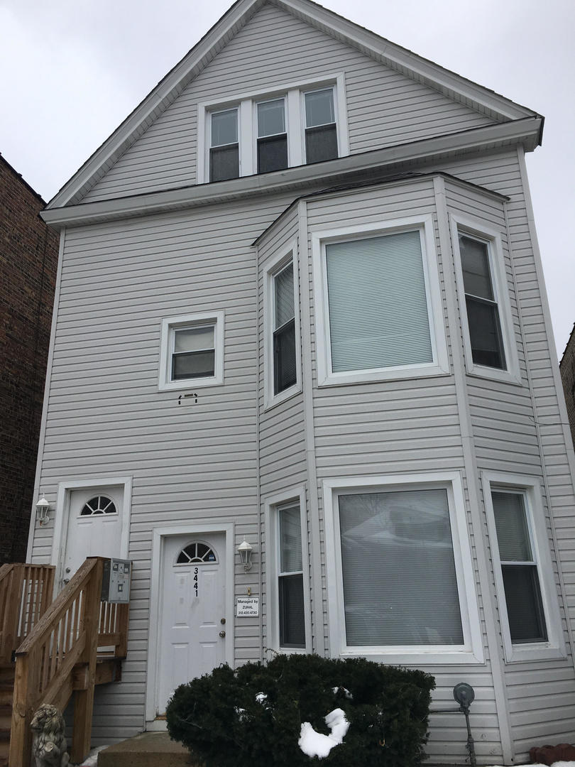 a front view of a house with parking