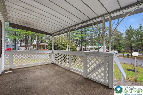 a view of porch with wooden fence
