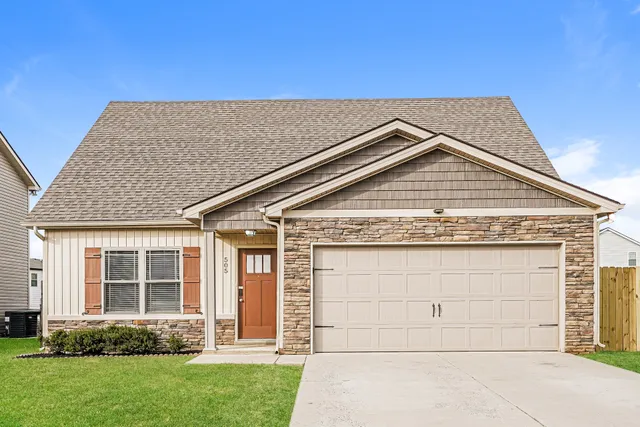 front view of a house with a yard