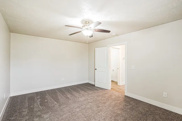 a view of a big room with carpet