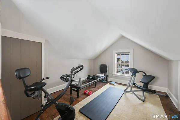 a living room with furniture and a piano