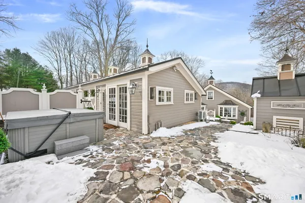 a front view of a house with a wooden fence