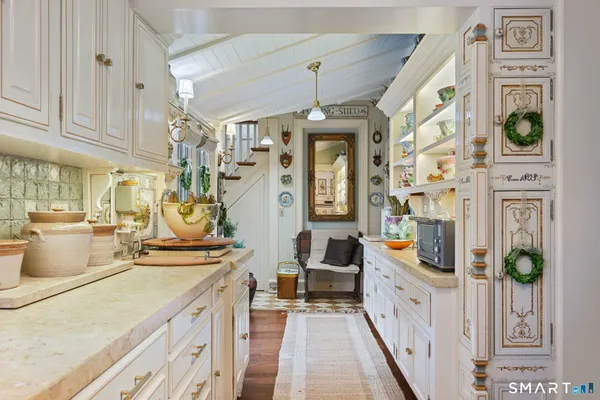 a view of a kitchen with furniture and chandelier
