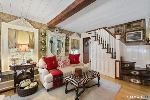 a living room with furniture and a window