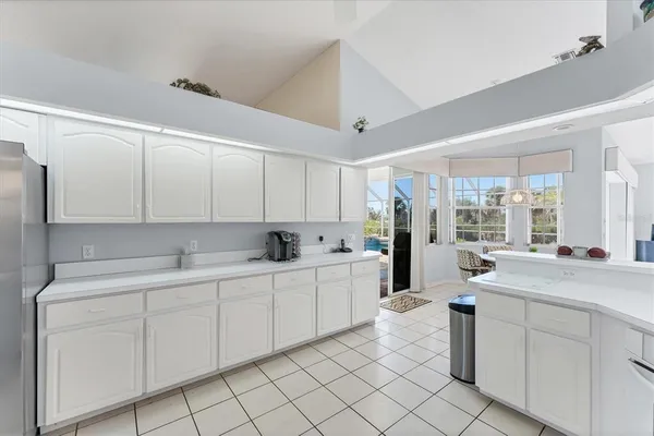 a kitchen with a sink appliances and cabinets