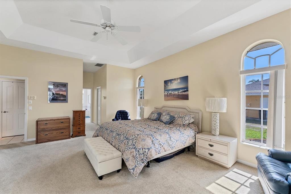 285 Spaniards Road Placida, FL 33946 - Photo 38 of 61 a spacious bedroom with a bed and a couch