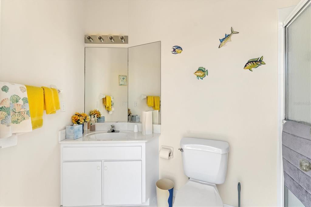 285 Spaniards Road Placida, FL 33946 - Photo 47 of 61 a bathroom with a sink mirror vanity and toilet