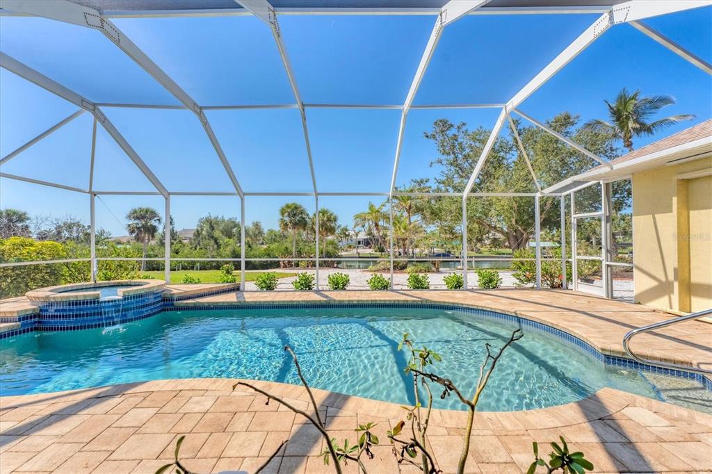 285 Spaniards Road Placida, FL 33946 - Photo 50 of 61 a view of a swimming pool with a yard