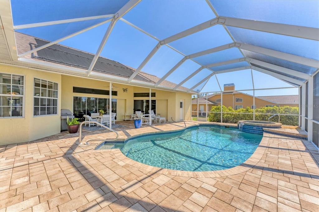 285 Spaniards Road Placida, FL 33946 - Photo 51 of 61 a view of a patio with table and chairs under an umbrella