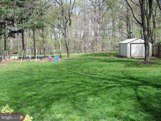 9 Hawthorne Road Kendall Park, NJ 08824 - Photo 2 of 5 a view of a park with large trees
