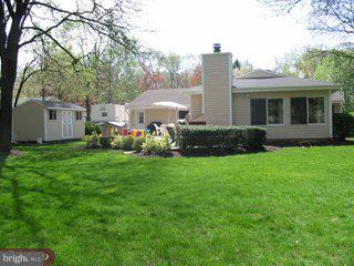 9 Hawthorne Road Kendall Park, NJ 08824 - Photo 5 of 5 a view of a house with backyard sitting area and garden