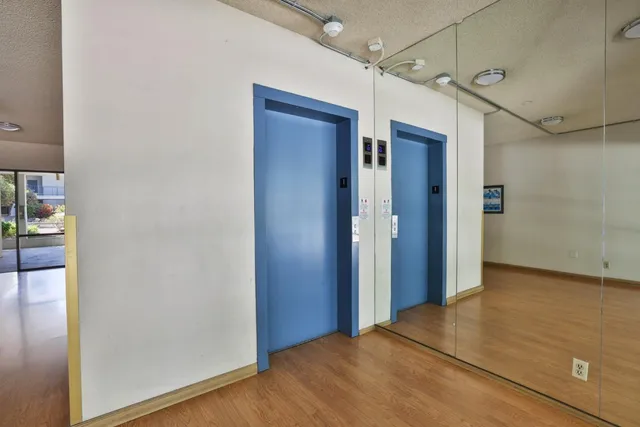 a view of a living room and chandelier