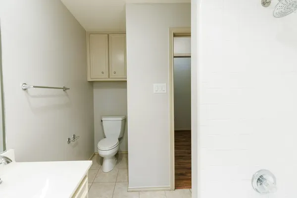 a bathroom with a toilet and a sink