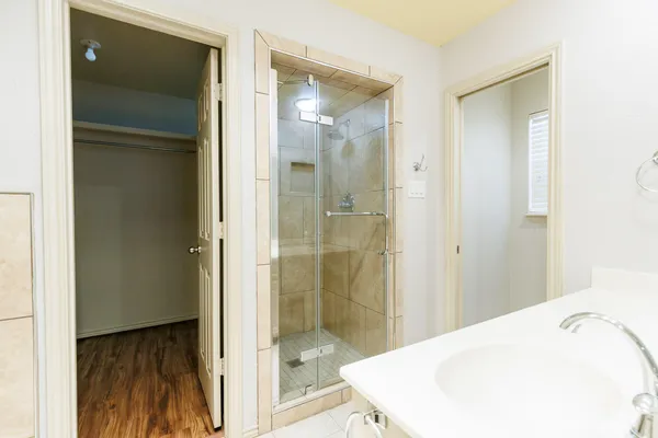 a bathroom with a tub and shower