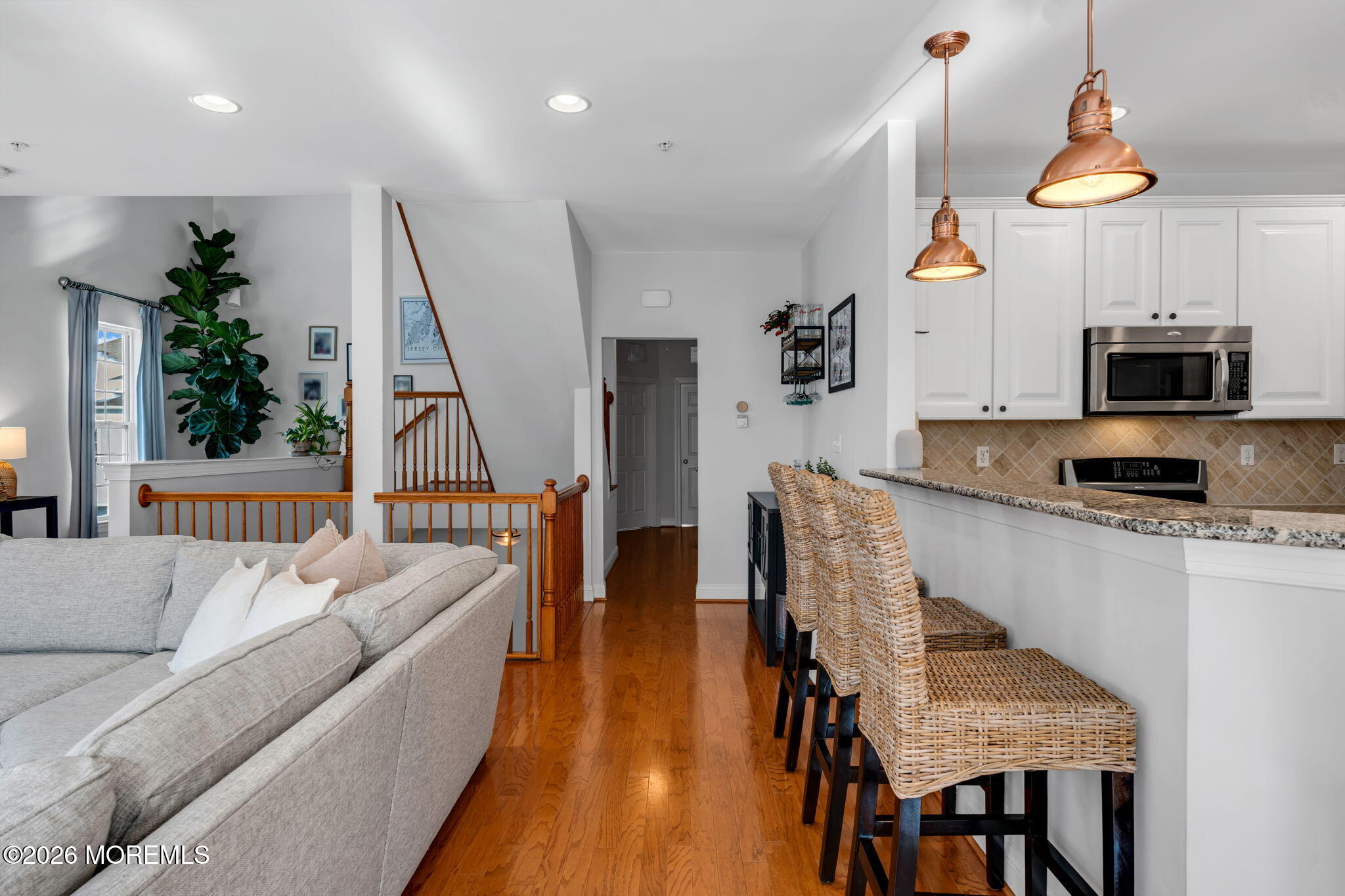 712 Abby Road Middletown, NJ 07748 - Photo 15 of 44 a living room with furniture a flat screen tv and a table