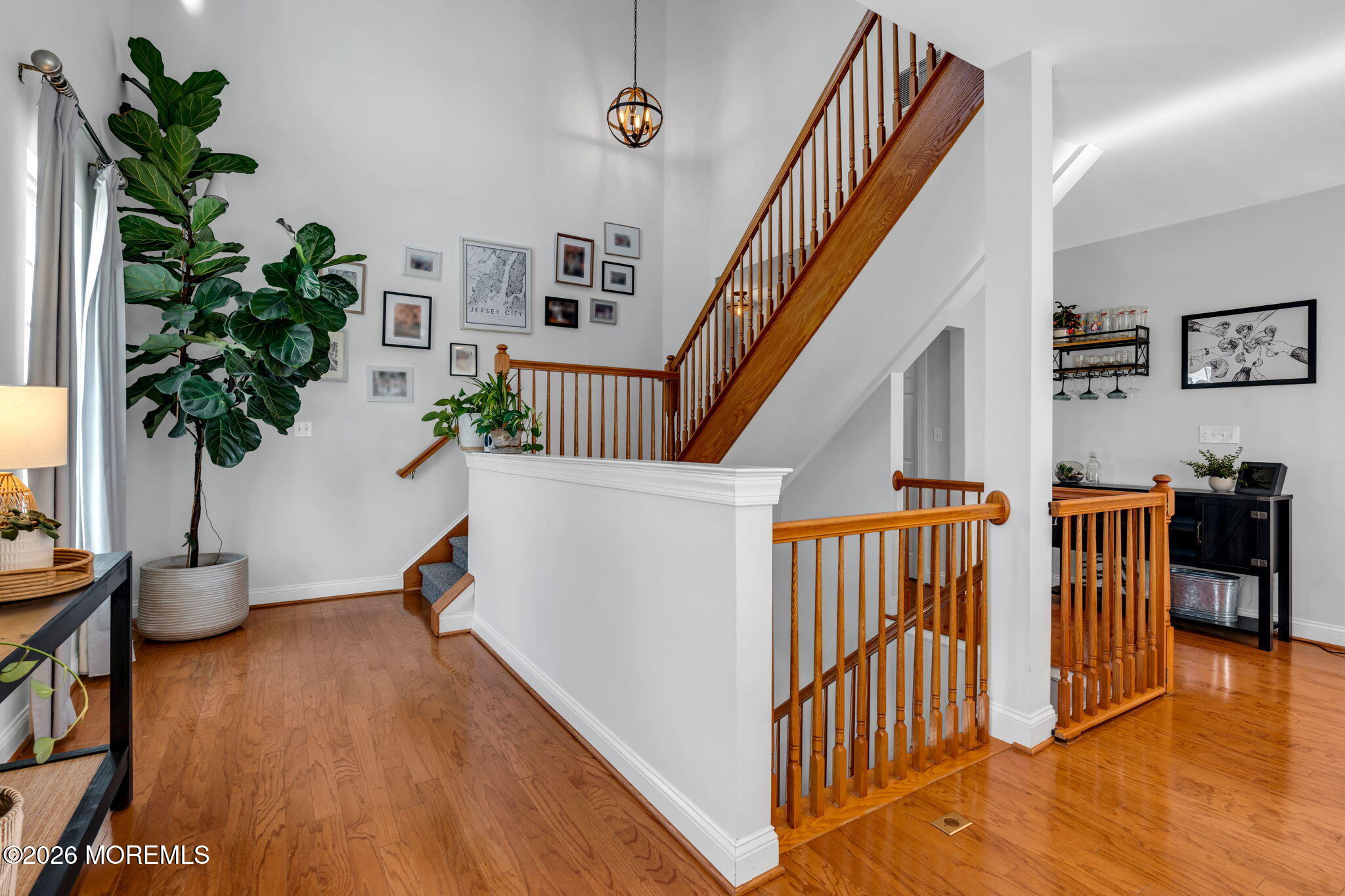712 Abby Road Middletown, NJ 07748 - Photo 24 of 44 a view of entryway with wooden floor and a potted plant