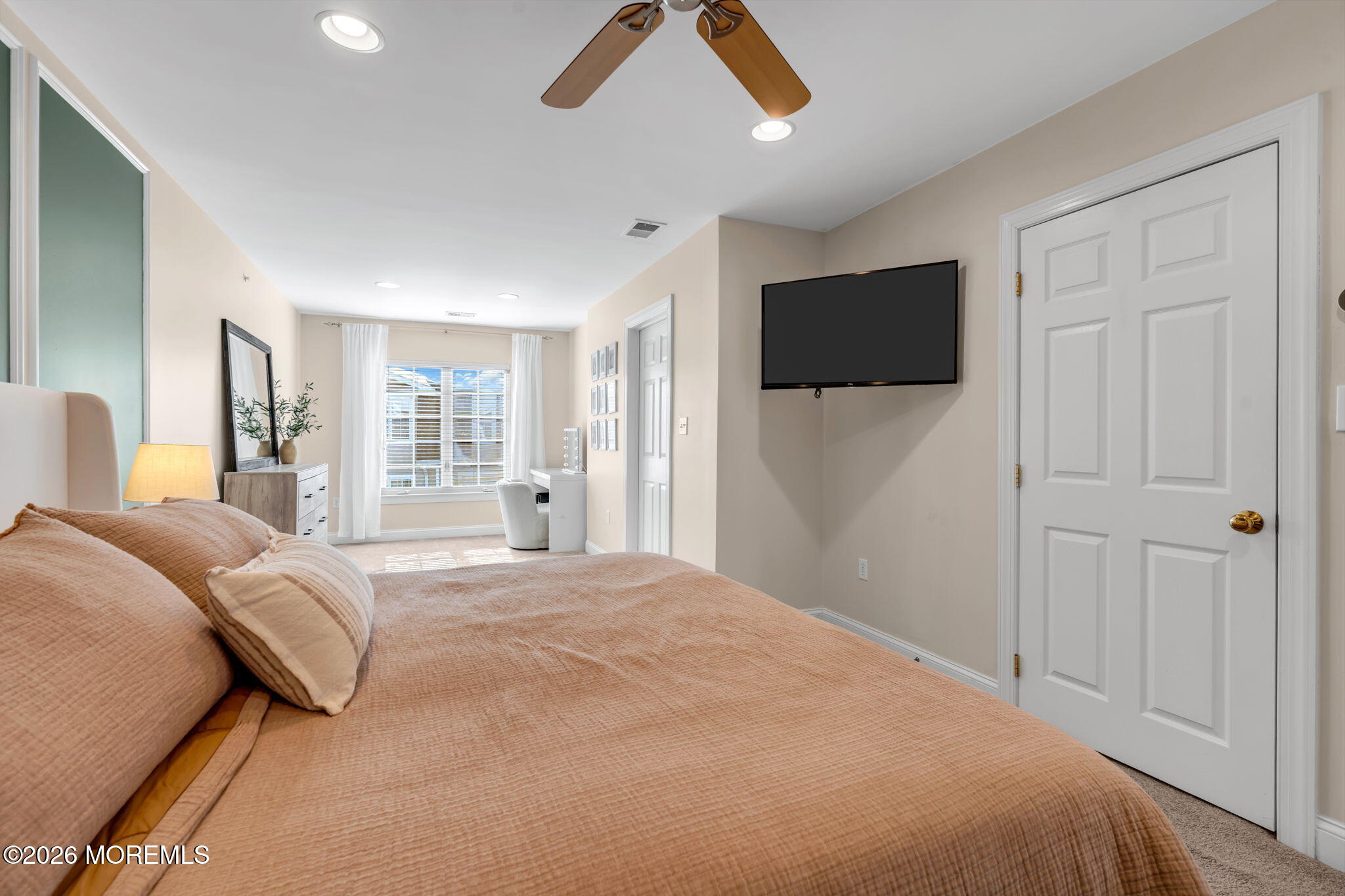 712 Abby Road Middletown, NJ 07748 - Photo 32 of 44 a bedroom with a bed and a flat screen tv