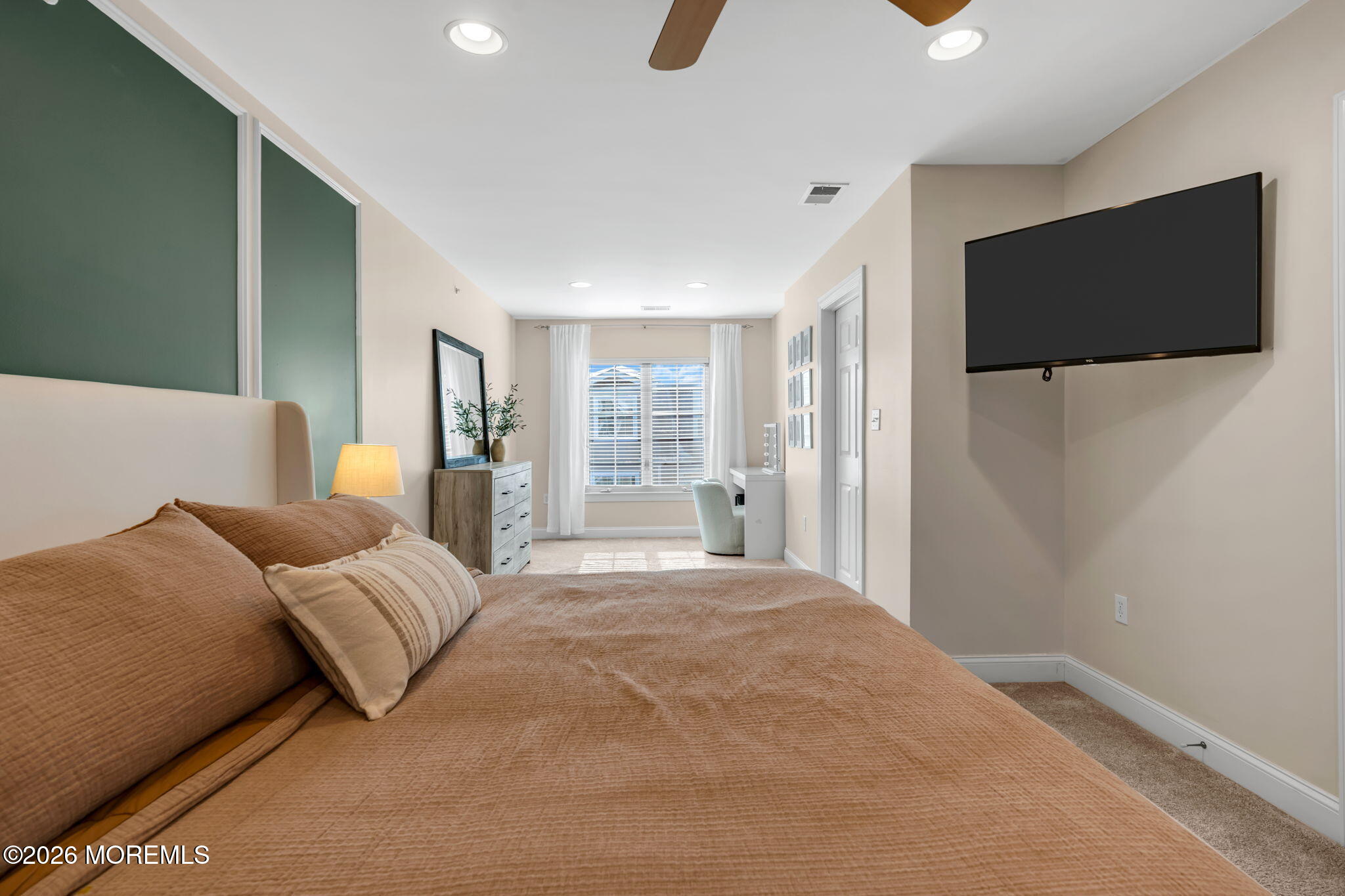 712 Abby Road Middletown, NJ 07748 - Photo 33 of 44 a bedroom with a bed and a flat screen tv