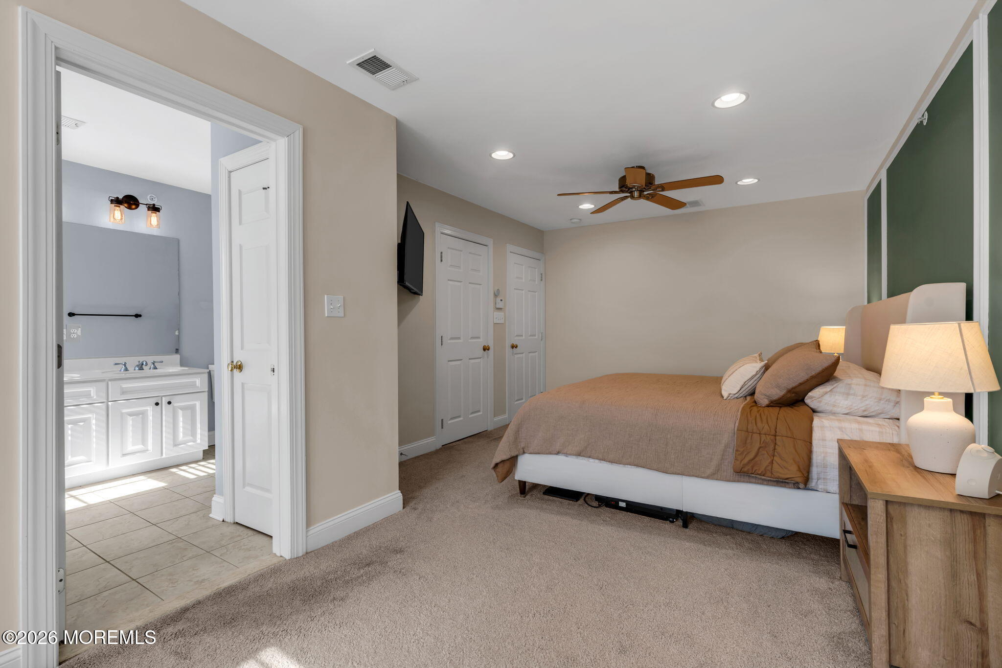 712 Abby Road Middletown, NJ 07748 - Photo 35 of 44 a bed room with a bed and a view of bathroom