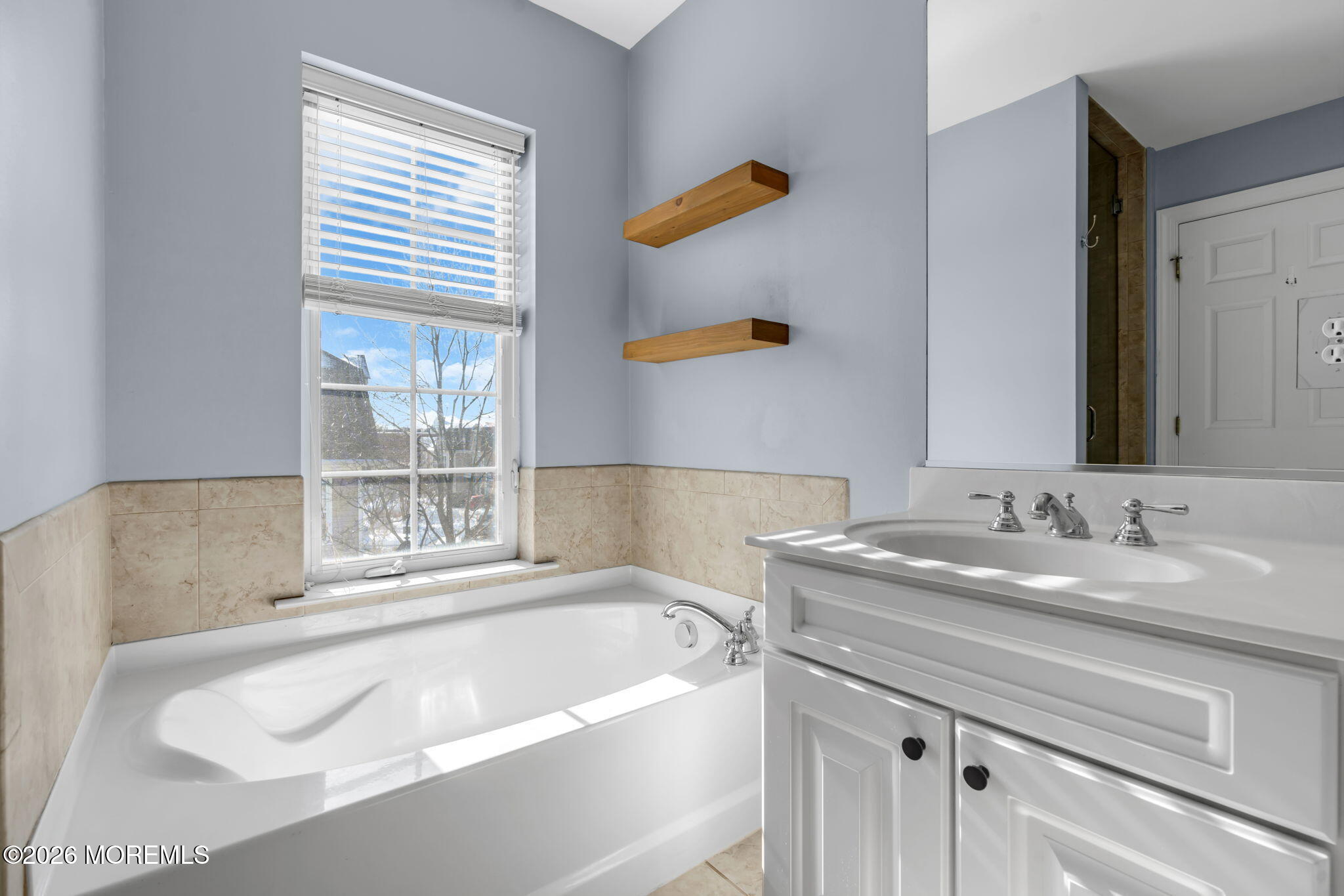 712 Abby Road Middletown, NJ 07748 - Photo 37 of 44 a bathroom with a granite countertop sink and a bathtub