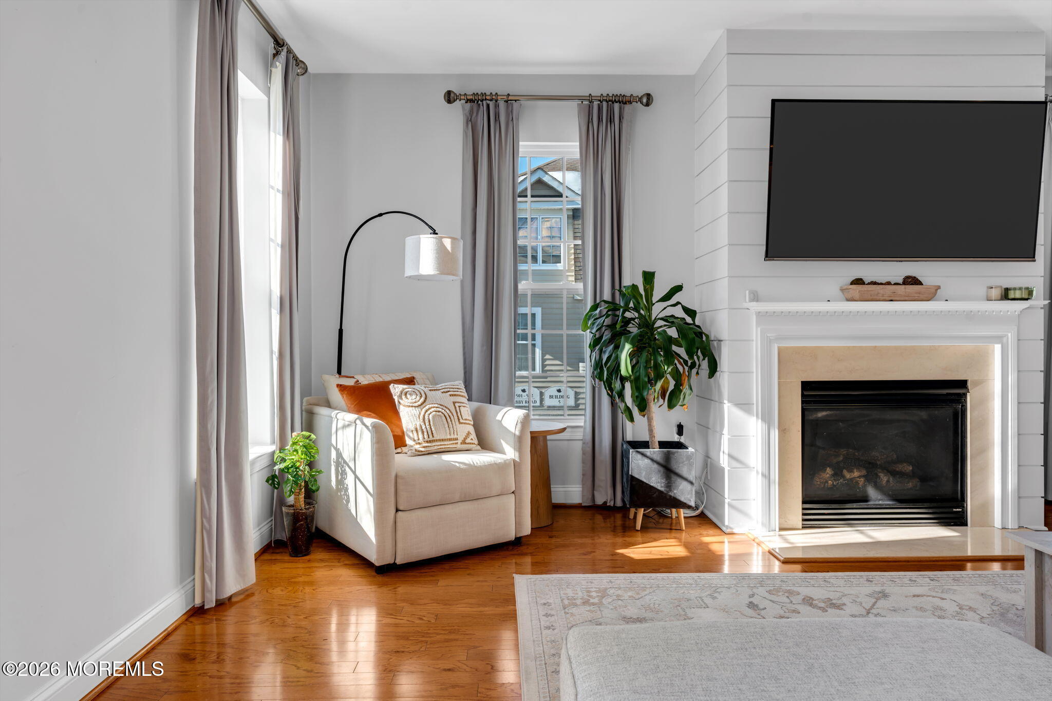 712 Abby Road Middletown, NJ 07748 - Photo 44 of 44 a living room with furniture and a fireplace