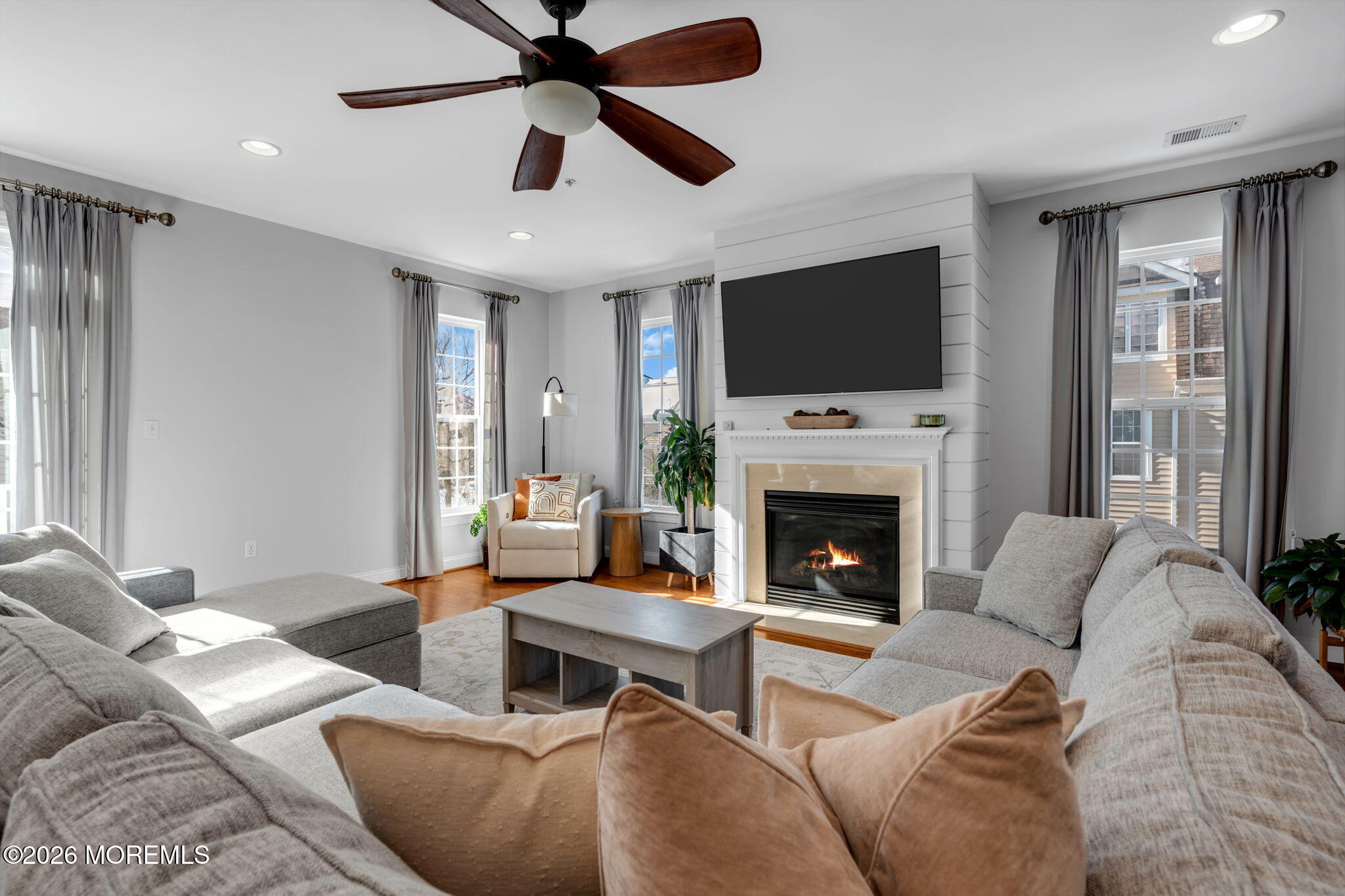 712 Abby Road Middletown, NJ 07748 - Photo 6 of 44 a living room with furniture fireplace and flat screen tv