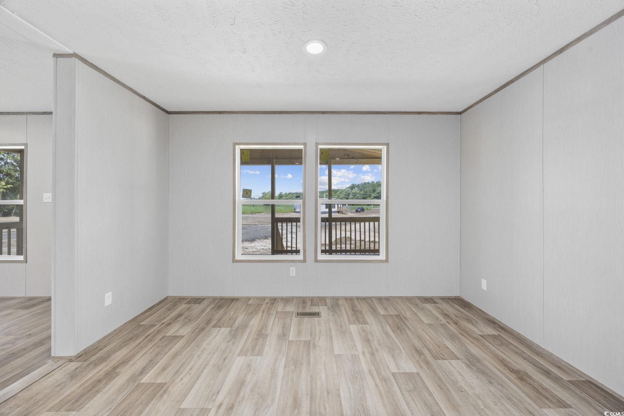 491 North Green Sea Road Loris, SC 29569 - Photo 27 of 39 Unfurnished room featuring wood finished floors an