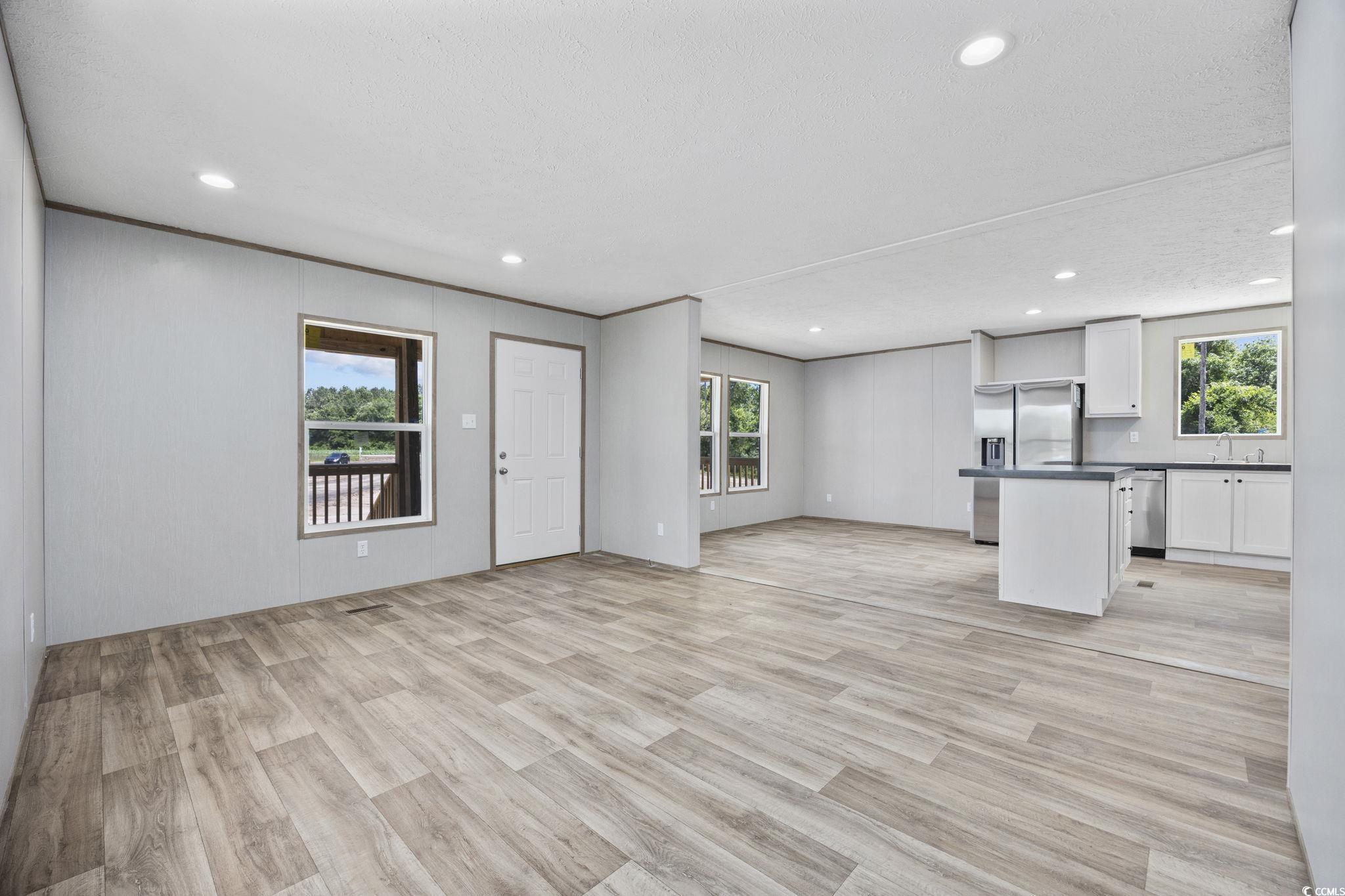 491 North Green Sea Road Loris, SC 29569 - Photo 32 of 39 Unfurnished living room with plenty of natural lig