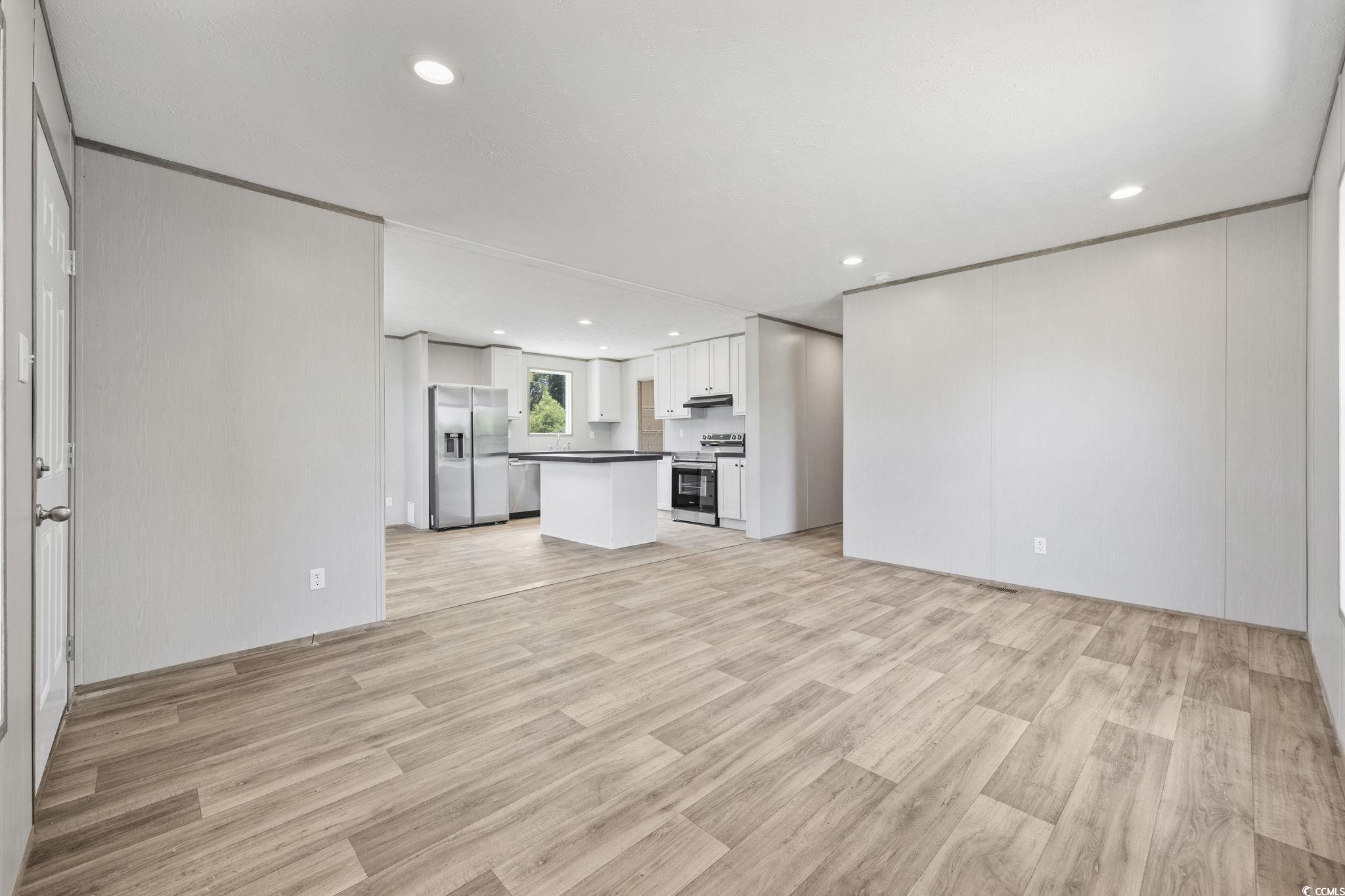 491 North Green Sea Road Loris, SC 29569 - Photo 33 of 39 Unfurnished living room featuring light wood-type