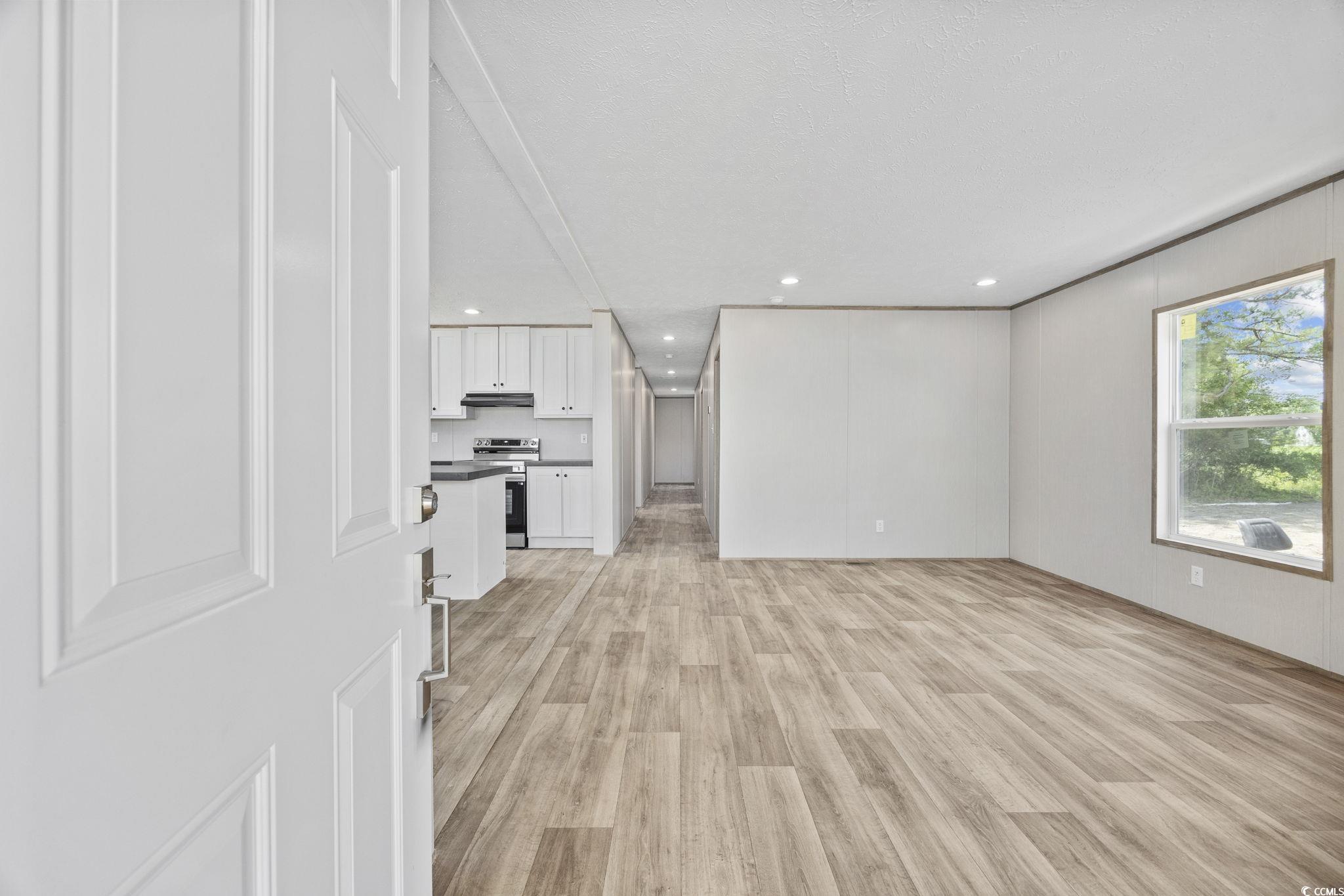 491 North Green Sea Road Loris, SC 29569 - Photo 35 of 39 Unfurnished living room featuring light wood-type