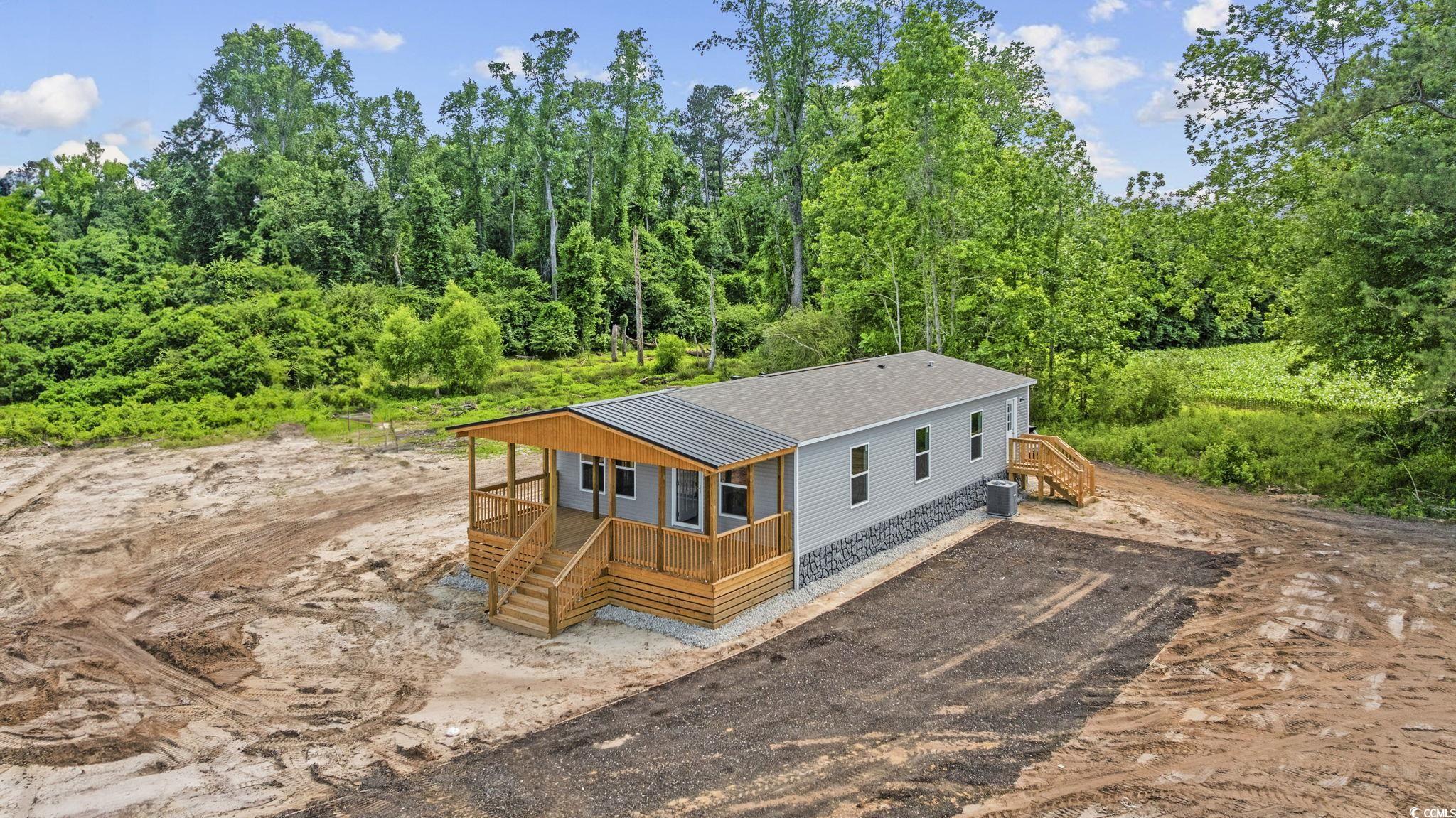 491 North Green Sea Road Loris, SC 29569 - Photo 38 of 39 Back of house featuring driveway, a shingled roof,
