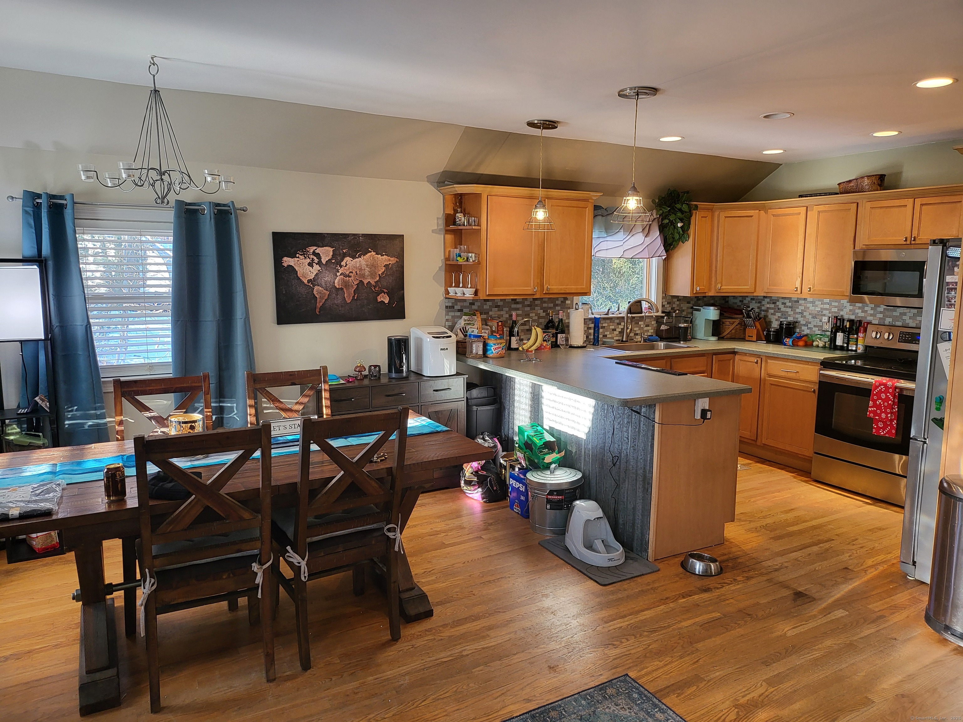 34 Transylvania Road Woodbury, CT 06798 - Photo 5 of 17 a kitchen with sink refrigerator dining table and chairs
